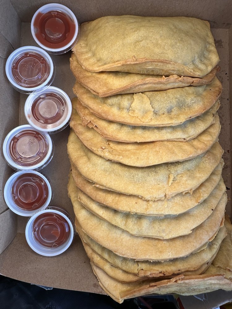 A large catering box of Jamaican beef patties
